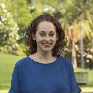 Photo of Christina smiling in outdoor setting